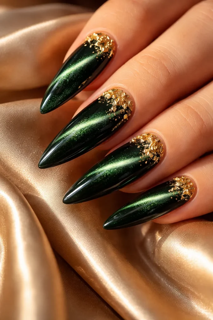 Dark green cat eye nails decorated with genuine gold flakes and magnetic shimmer.