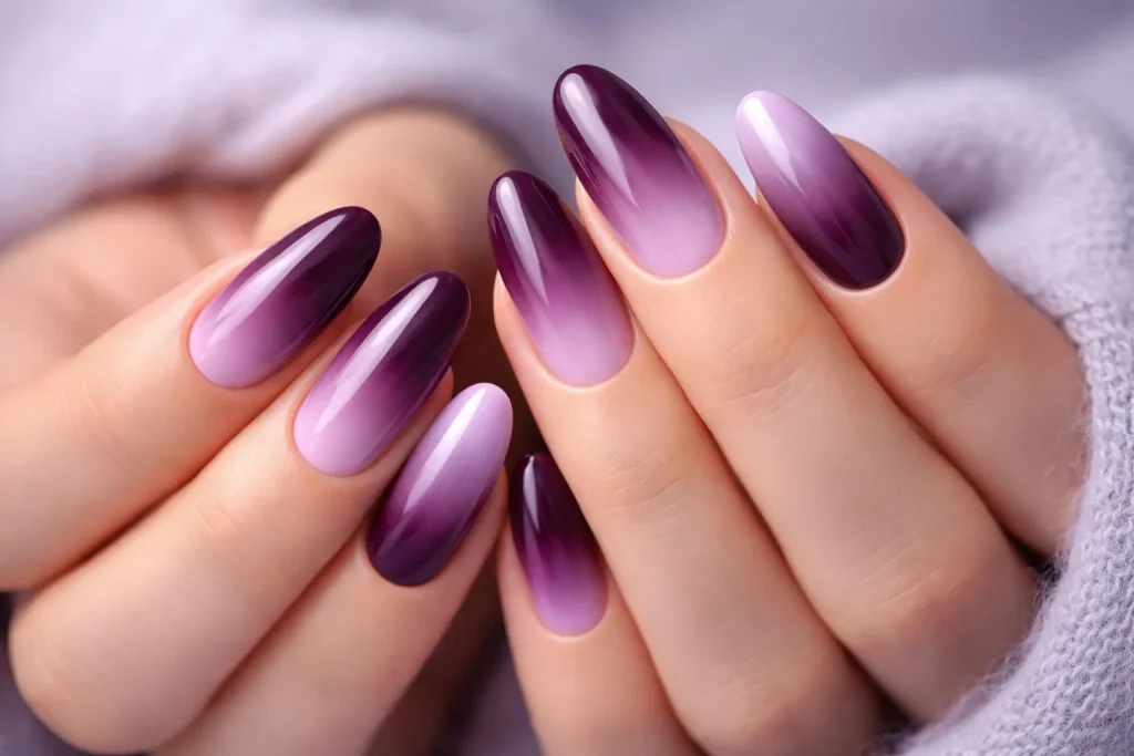 Seamless plum to lavender ombre gradient winter nails.