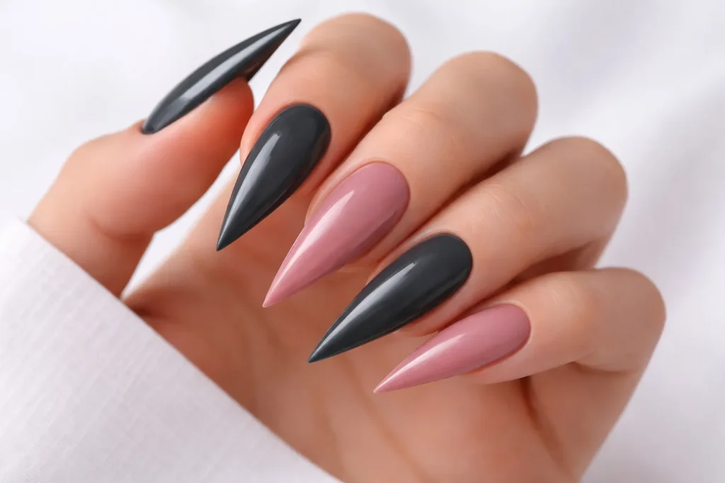 Two-tone stiletto nails featuring alternating grey and dusty rose colors