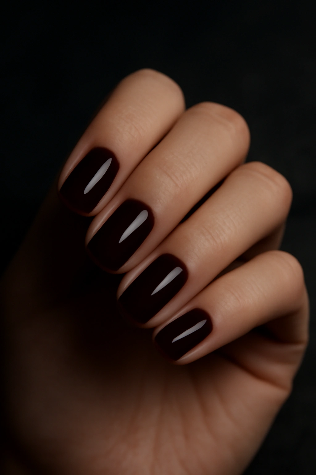 Deep burgundy wine colored nail polish on short square nails