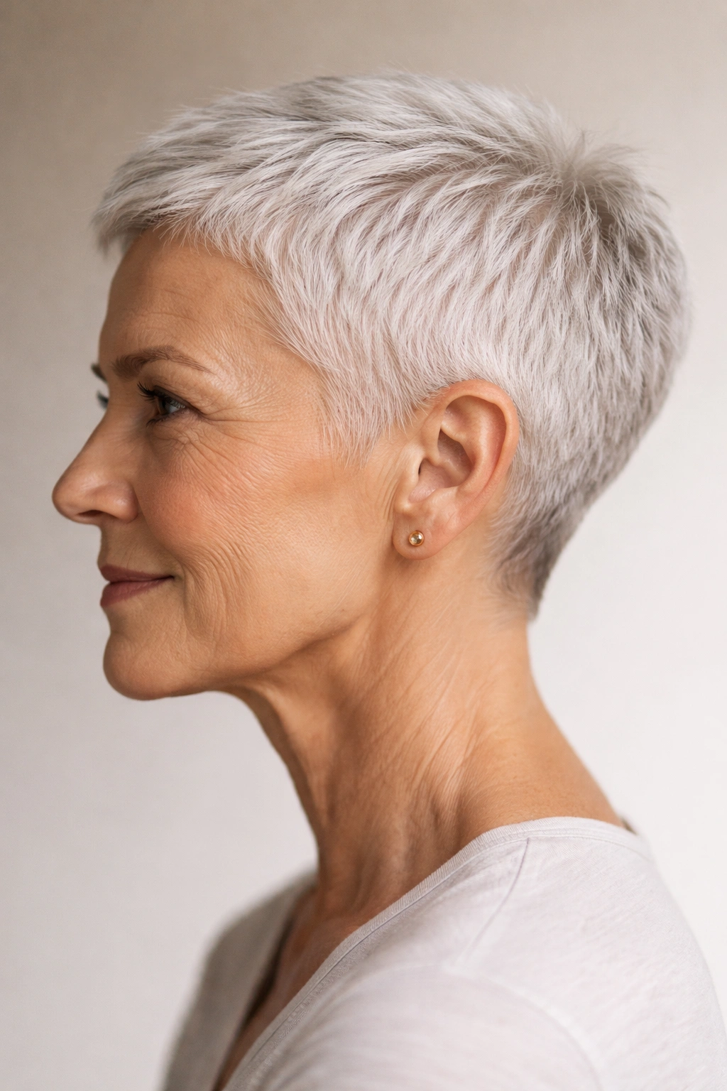 Close-up of a woman with a cropped cut, bold short hairstyle