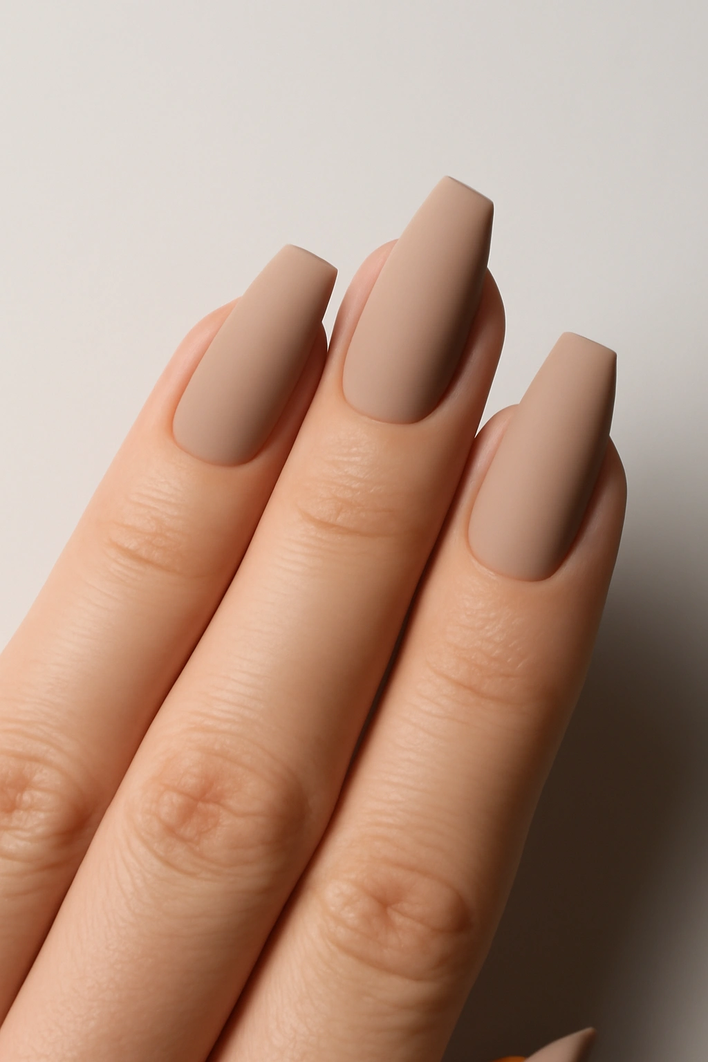 Modern edge nails with a geometric point on wider fingers, highlighting vertical lines for a flattering look.