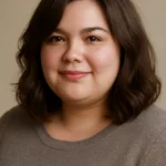 Portrait of a plus-size woman with a flattering medium-length hairstyle framing her face