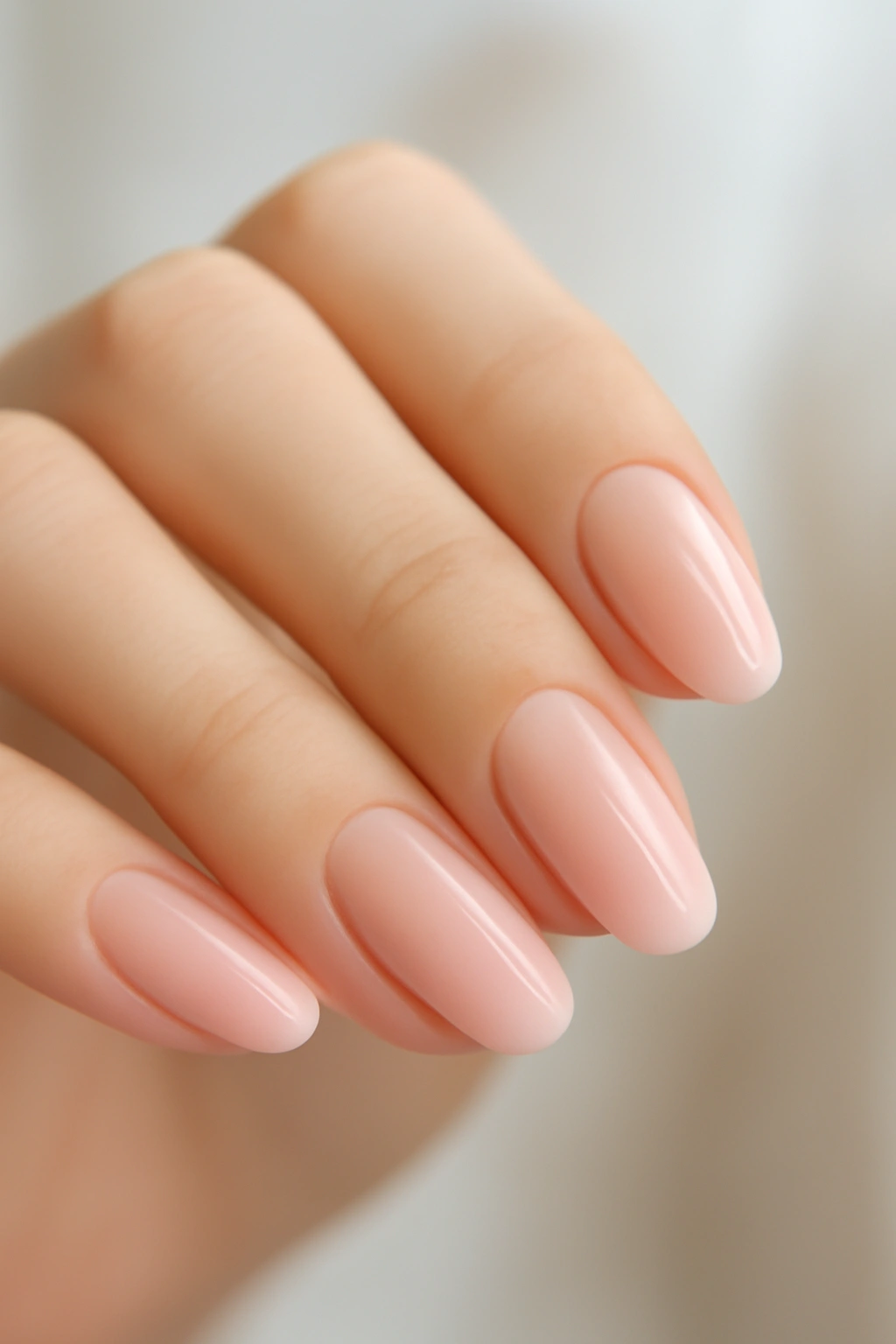 Soft ombre nails blending from nude to light pink